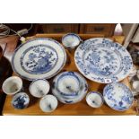 Three Chinese porcelain blue & white decorated dishes; a cast-iron door porter; three twin-branch