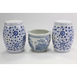 A Chinese pottery blue & white floral decorated fish bowl, 14¾” diam.; & a similar pair of barrel