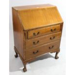 A 1930’s mahogany bureau, with fitted interior enclosed by fall-front above three long graduated