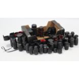 Twenty-three various camera lenses, some with cases.