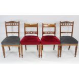 A pair of late Victorian mahogany bow-back dining chairs, with padded seats & on ring-turned tapered