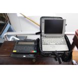 A Toshiba “Satelite” portable laptop; an Amstrad “Notepad” computer, each with case.