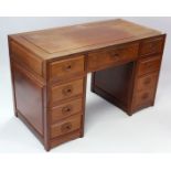 A modern Chinese rosewood pedestal desk, fitted with an arrangement of eight drawers with carved