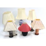 Six various table lamps, each with shade.