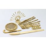 Seven various antique carved ivory parasol handles; an ivory letter opener; an ivory circular