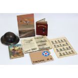 A WWII steel safety helmet; together with a scrapbook album containing numerous aircraft cut-outs,