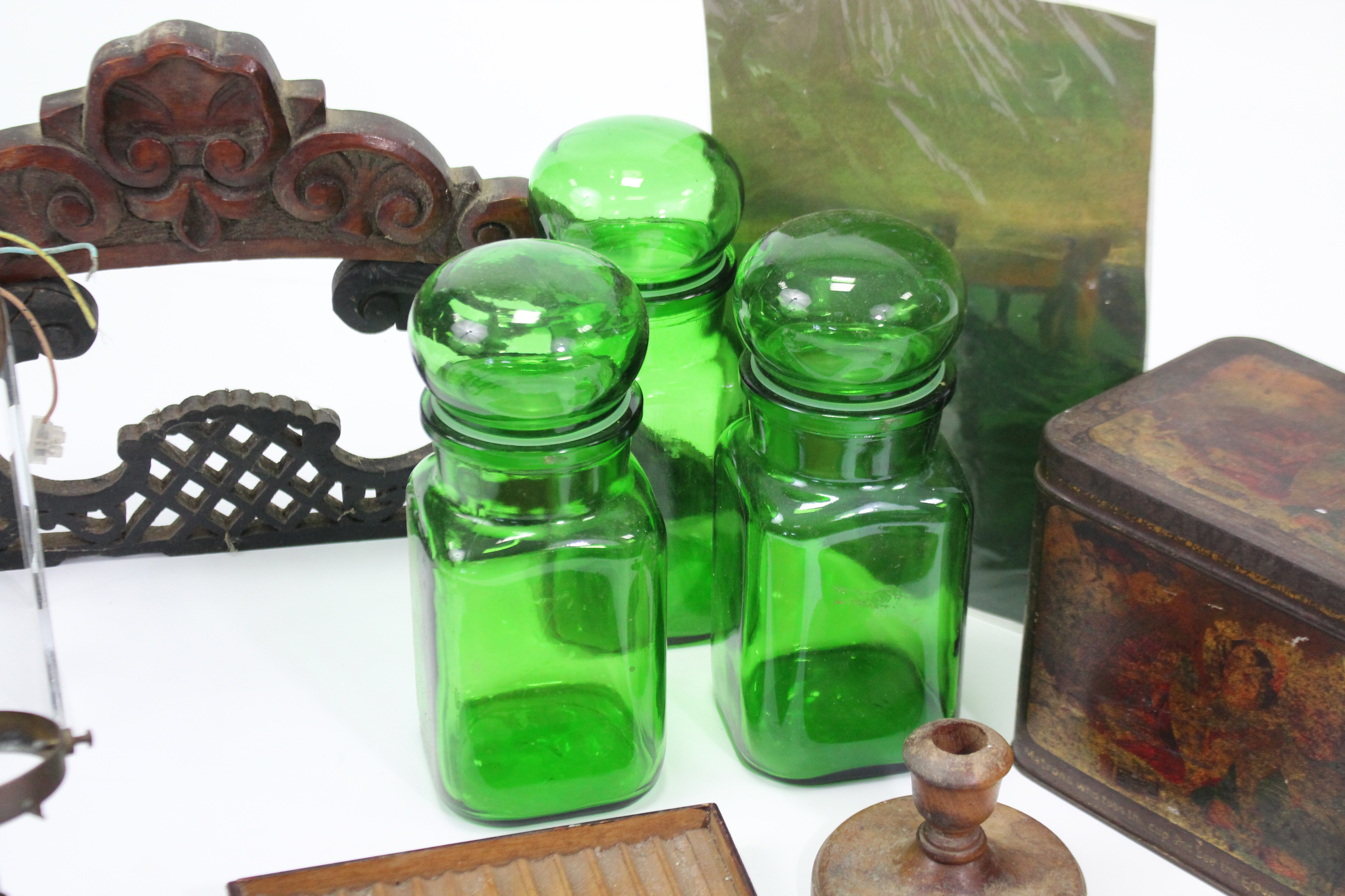 Three green tinted glass storage jars; a “Mazawattee” tea tin; a pair of treen candlesticks; three - Image 3 of 4