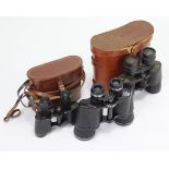 Three pairs of binoculars, two with cases.