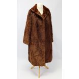 A mid-20th century rabbit fur silk-lined ladies three-quarter length coat bears label “Cornelius,