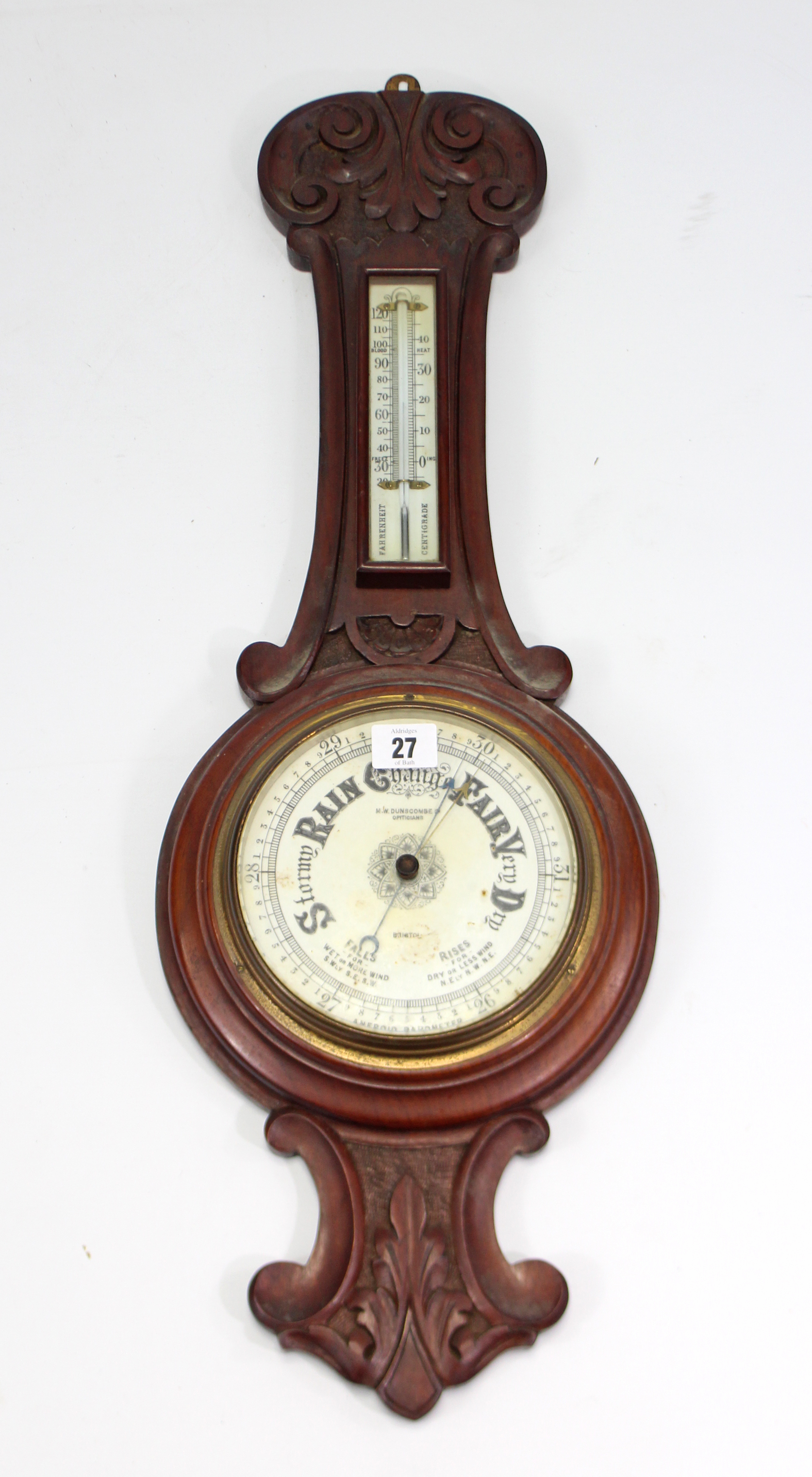 A late 19th/early 20th century aneroid wall barometer the 6” diameter white enamel dial signed “M.