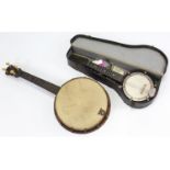 A mandolin with case; & a banjo (lacking strings).