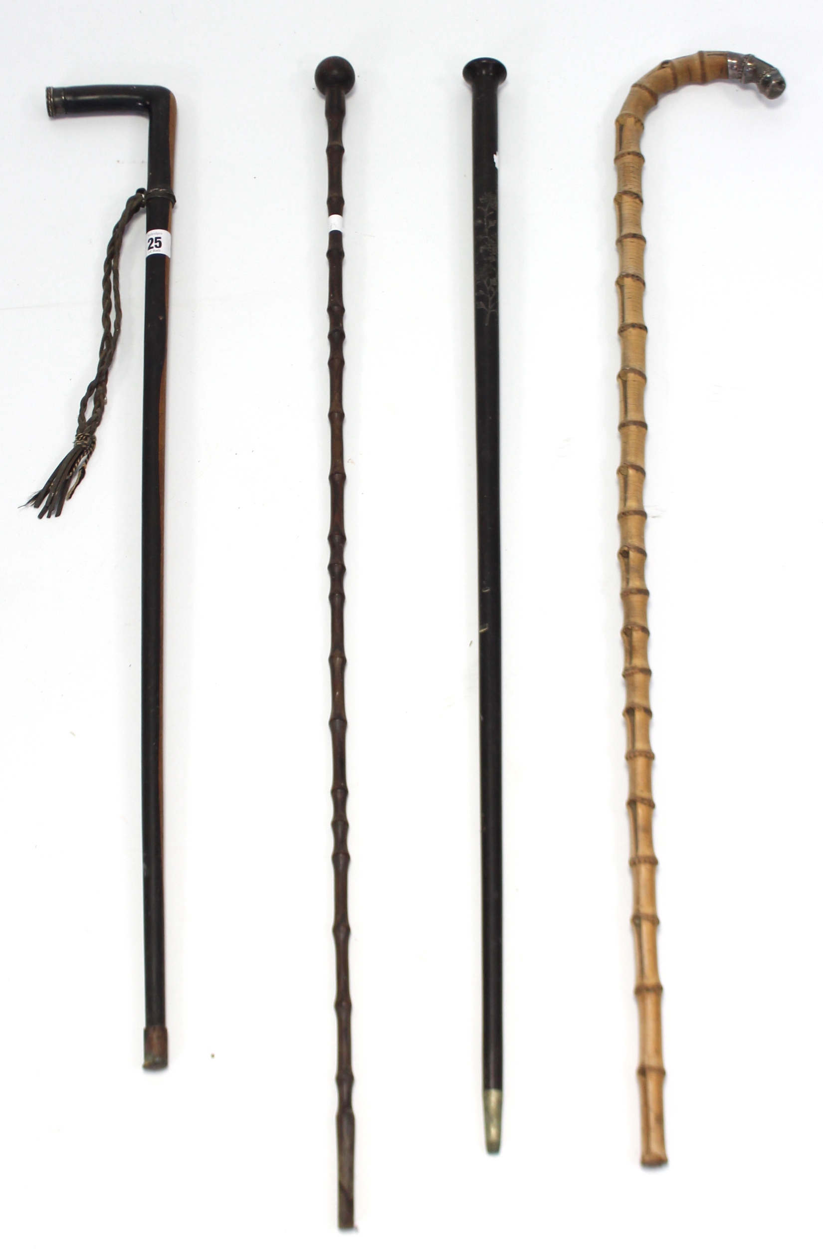 Four late Victorian gent’s walking canes, one with silver mount.