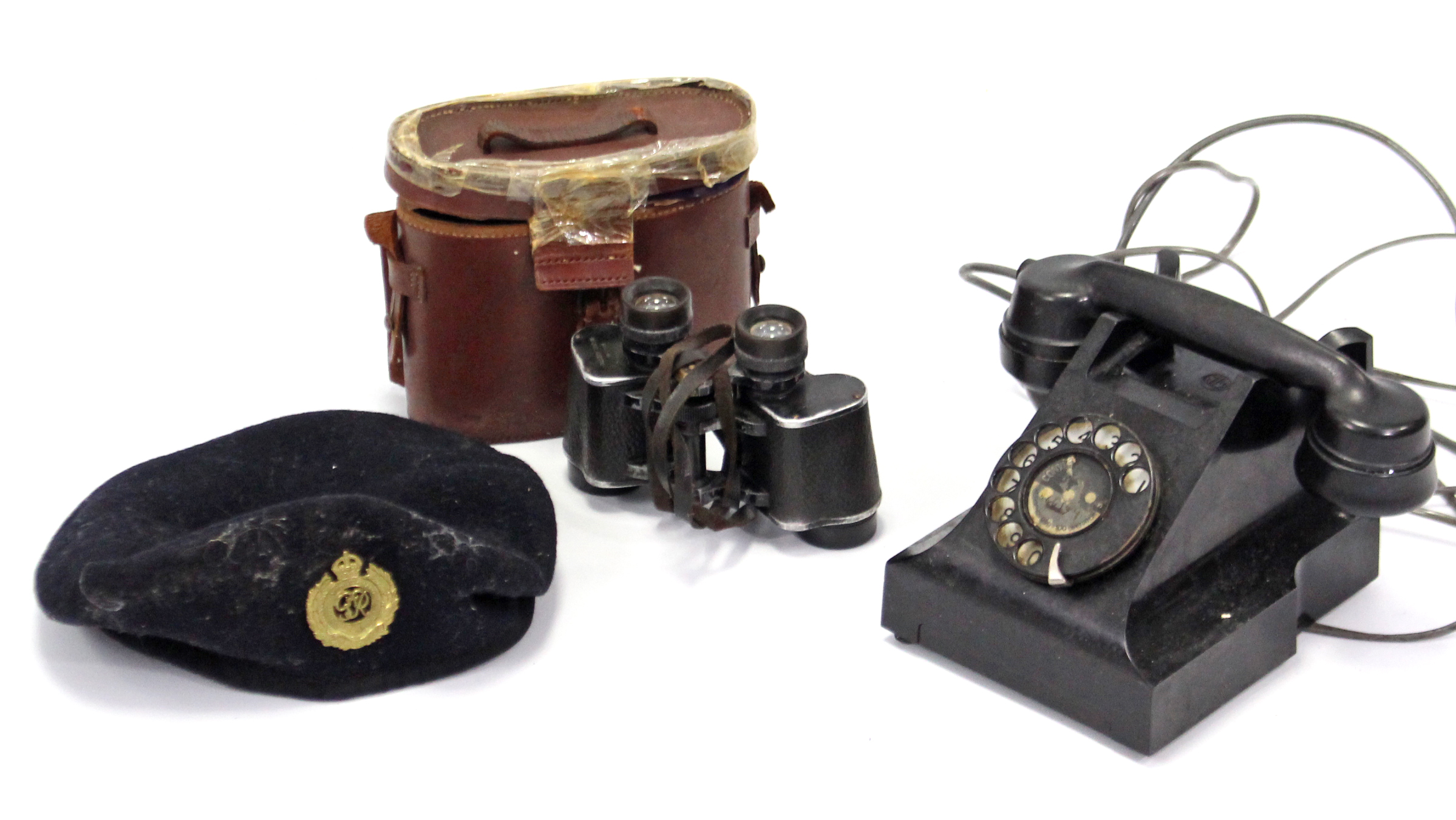 A 1960’s black Bakelite telephone; a pair of Dollond’s “Standard” binoculars, with case; & a British