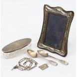 A silver rectangular photograph frame; two silver teaspoons; a silver watch Albert with silver