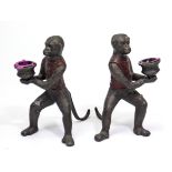 A pair of cold-painted bronzed novelty monkey character candlesticks, 6¾” high.