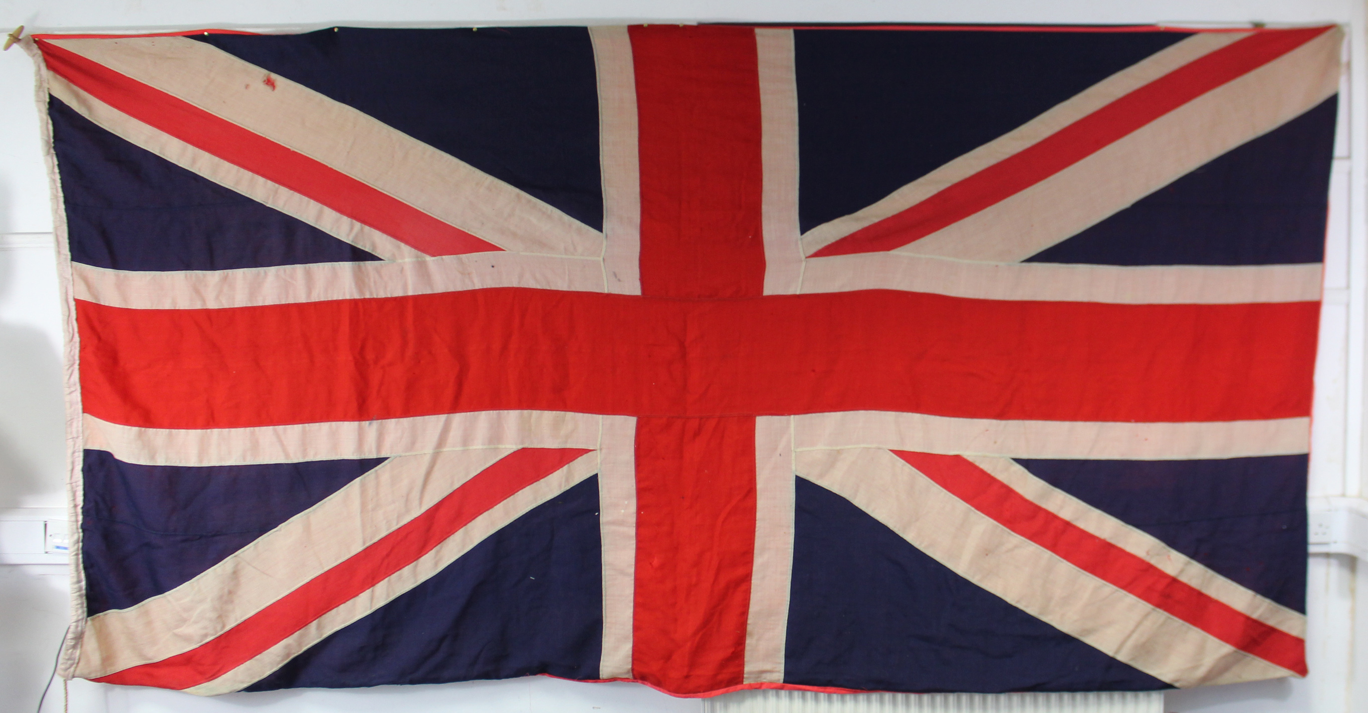 A large Union Jack flag, 68” x 128”.