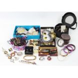 A silver octagonal compact; a gilt-metal ditto; seven pens; various items of costume jewellery, etc.