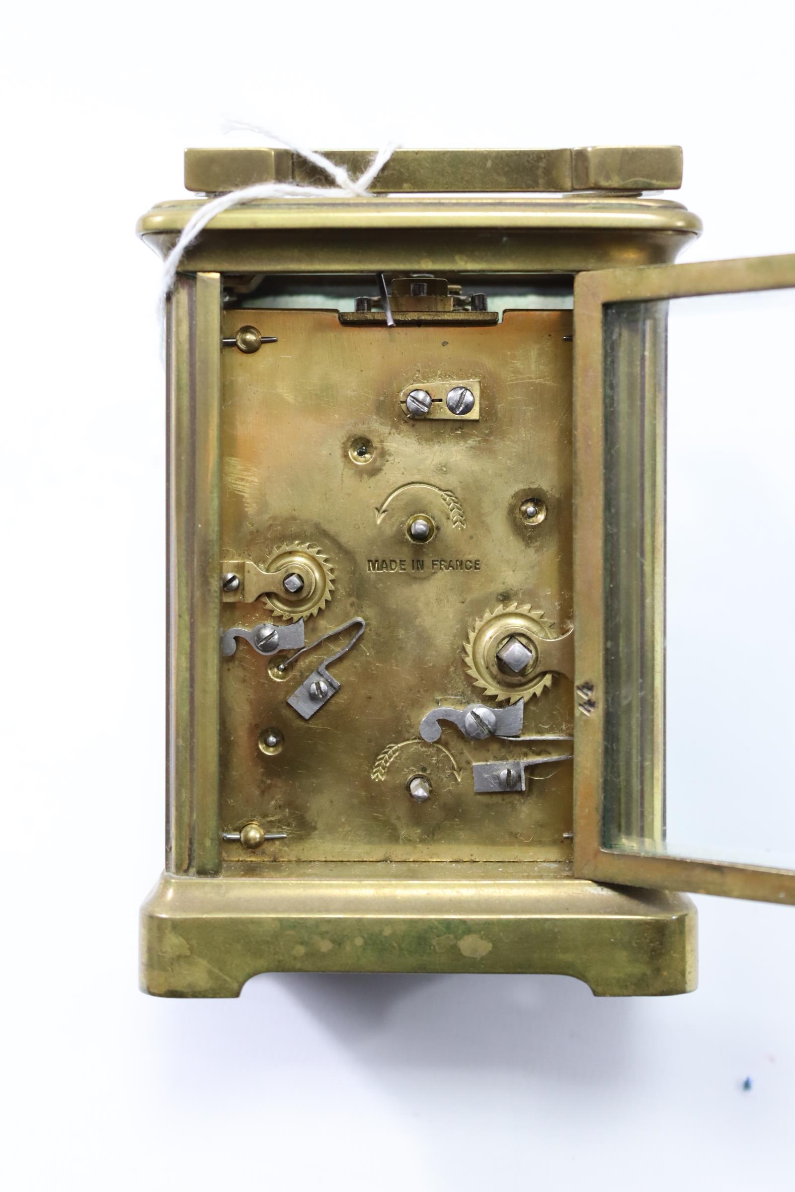 A French brass-cased carriage timepiece, 4¼” high, with travelling case (travelling case w.a.f.). - Image 2 of 3