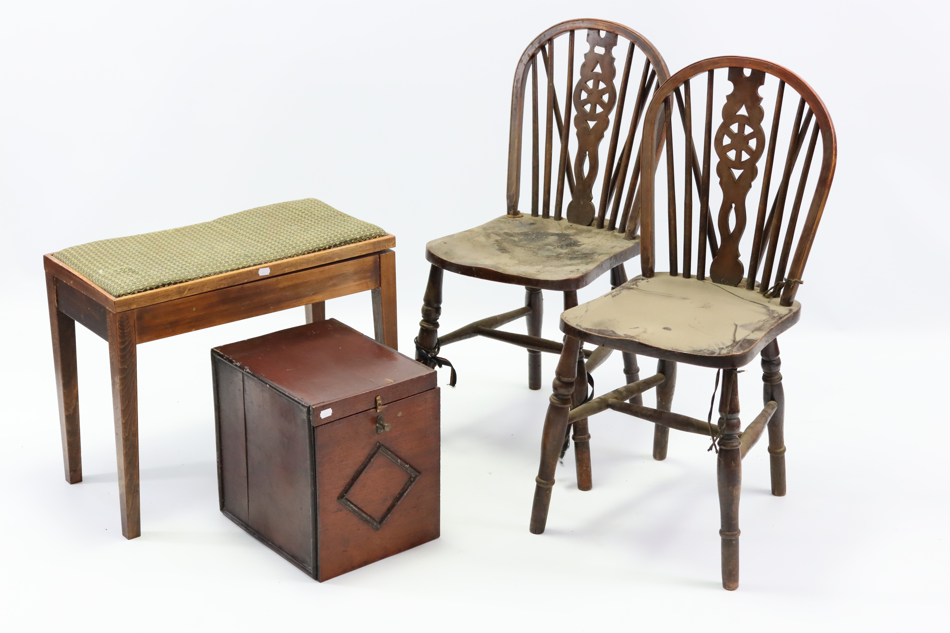 Three wheel-back kitchen chairs with hard seats & on turned legs with spindle stretchers; together