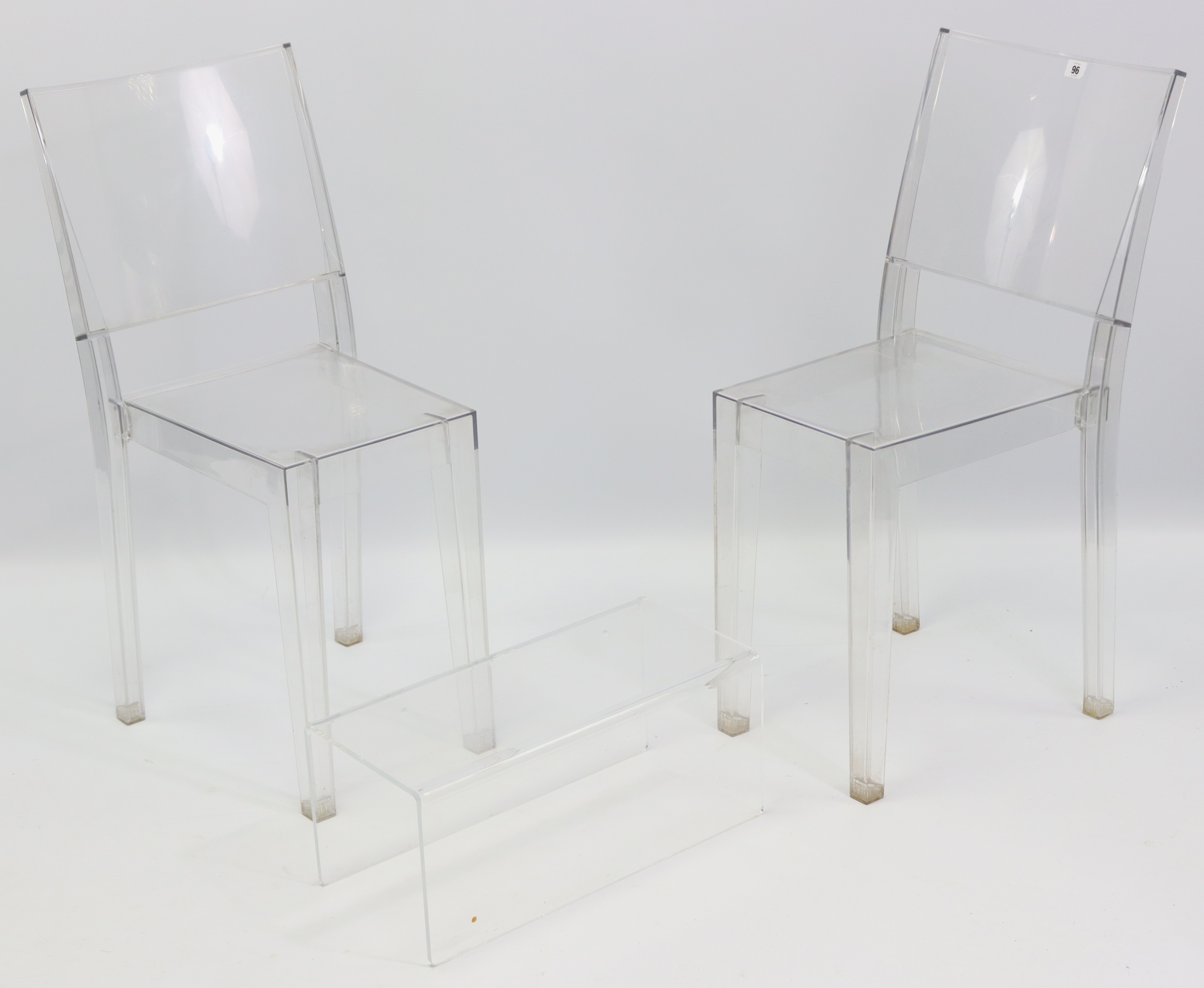 A pair of Italian “La Marie” clear Perspex dining chairs by Starck for Kartell; & a similar