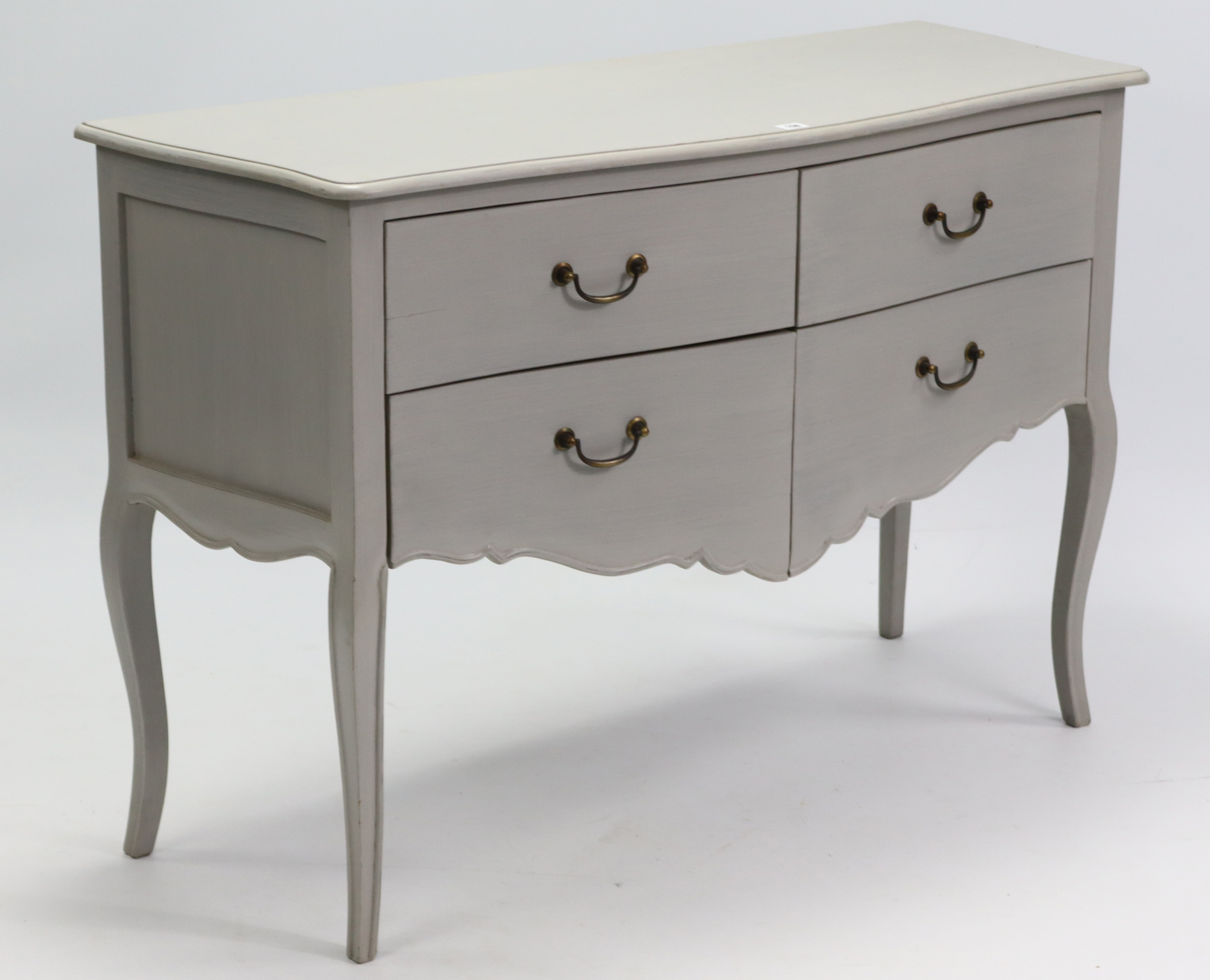 A continental-style light grey painted wooden “bombé” chest, fitted with an arrangement of four