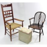 An early 20th century oak spindle & rail-back elbow chair with woven-string seat, & on turned