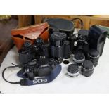 A Canon “EOS 1000F” camera; various camera accessories; three pairs of binoculars; & a collection of