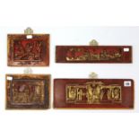 Four Chinese red & gold lacquered & carved wooden rectangular panels – various sizes.