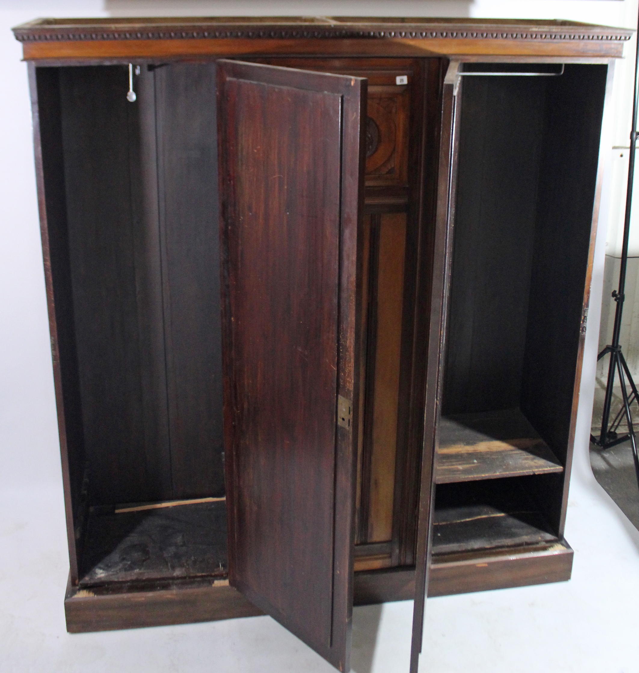 An Edwardian walnut wardrobe with moulded cornice, having fitted interior enclosed by carved panel - Image 4 of 5