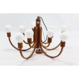 A Domus “Candela” ten-branch wooden chandelier, 34” wide x 18¾” high.