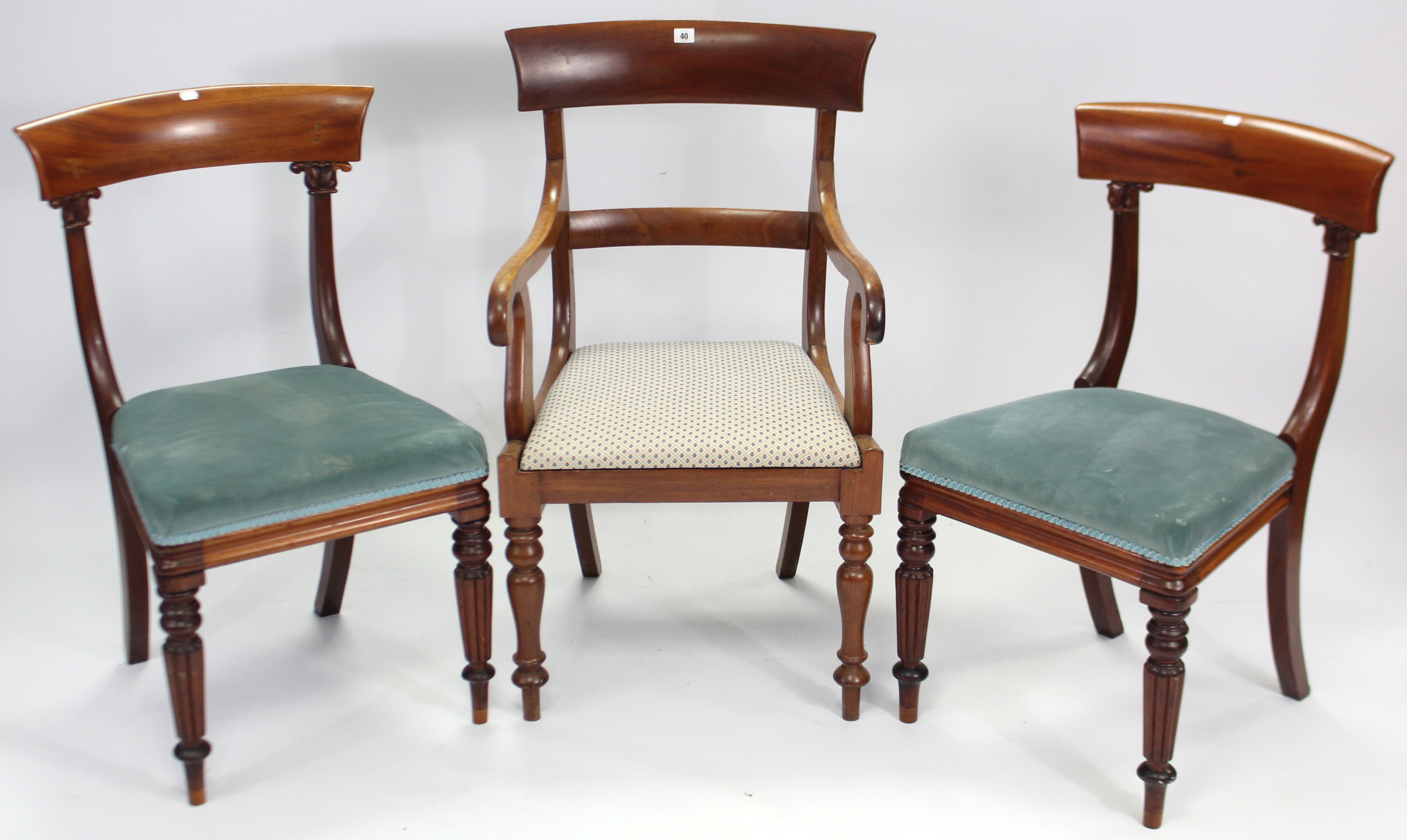 An early Victorian mahogany carver dining chair with open scroll-arms, padded drop-in seat, & on