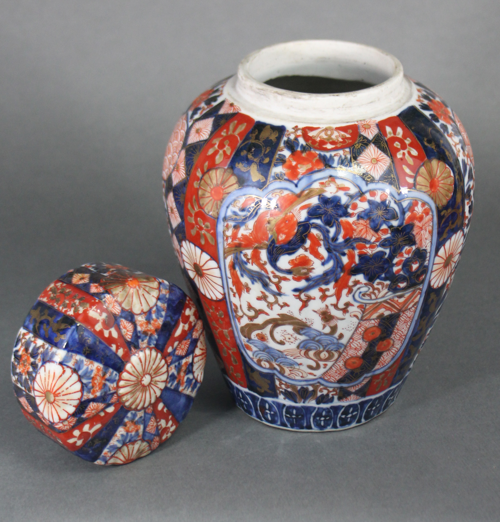 A 19th century Japanese Imari ginger jar & cover, the fluted ovoid body decorated with foliage & - Image 4 of 5