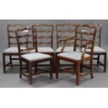 A set of six 18th century-style mahogany dining chairs, including an elbow chair, each with