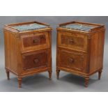A pair of carved burr & figured walnut bedside cabinets, each with raised gallery & inset marble top