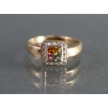 A coloured sapphire & diamond ring, the centre set square-cut yellow, pink, orange, & pale green
