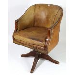 A tub-shaped swivel office chair, with rounded back & reeded arms upholstered