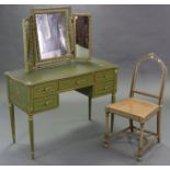 A reproduction continental style dressing table painted in green & gold, fitted central frieze