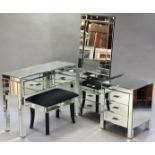 A mirrored four-piece bedroom suite comprising a two-drawer side table, 40½” wide; a pair of three-