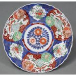 A 19th century Japanese Imari charger, with scalloped rim & floral decoration; 16” diam. (small