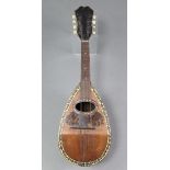 An Italian mandolin with tortoiseshell & bone-inlaid decoration, 24¼” long lacking case.