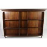 A large set of mahogany open wall shelves with dentil frieze, & with shaped end supports, 63” wide x