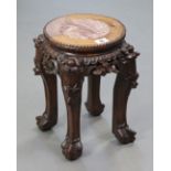 A Chinese-style carved hardwood jardinière stand inset marble to the circular top, & on four