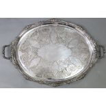 A large silver-plated oval two-handled tray with engraved floral decoration, 29” x 20”.