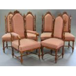 A set of six Carolean-style carved walnut dining chairs, including an armchair, each with foliate