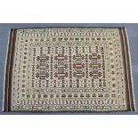 A Kelim rug of ivory ground with repeating geometric design, within multiple borders, 53” wide x 75”