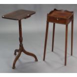 A mahogany occasional table with waved tray-top, fitted brushing slide to the frieze below, on