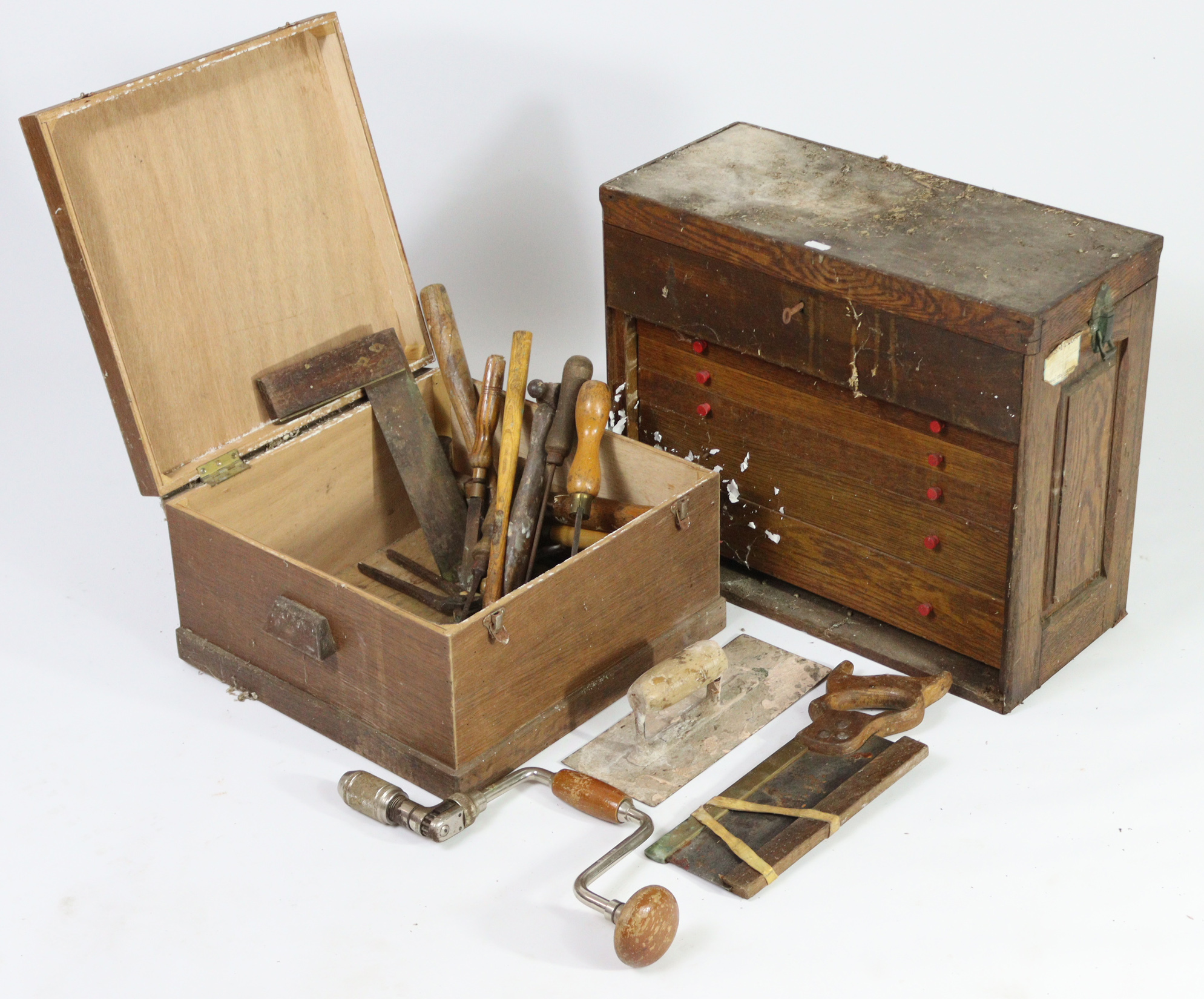 A collection of hand tools contained in two wooden boxes.