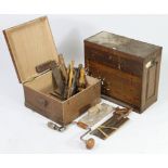 A collection of hand tools contained in two wooden boxes.