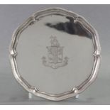 A Victorian silver card tray with raised & shaped beaded border, engraved armorial to centre, & on