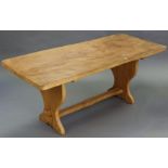 A MODERN ELM REFECTORY TABLE with rounded corners to the rectangular top, & on shaped end supports